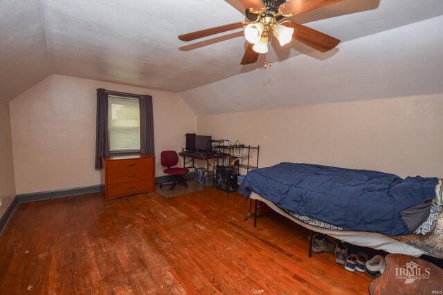 1816 W 13th St, Muncie, IN 47302 - bedroom featuring wood finished floors, lofted ceiling, an office area, and ceiling fan