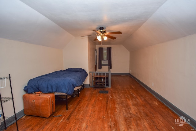1816 W 13th St, Muncie, IN 47302 - bedroom featuring wood finished floors, lofted ceiling, ceiling fan, and baseboards