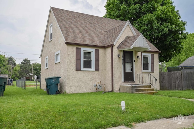 1816 W 13th St, Muncie, IN 47302 - view of front of home featuring roof with shingles and stucco siding