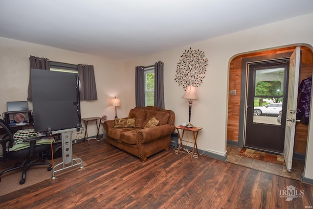 1816 W 13th St, Muncie, IN 47302 - living room with wood finished floors, baseboards, and arched walkways