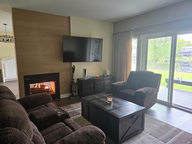 1300 Winding Ridge Ln Unit C-8, Valparaiso, IN 46383 - living area with wood finished floors, healthy amount of natural light, and a multi sided fireplace