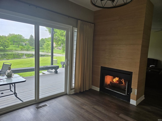 1300 Winding Ridge Ln Unit C-8, Valparaiso, IN 46383 - entryway featuring a lit fireplace, a water view, and dark wood finished floors