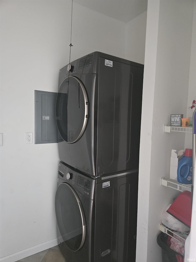1300 Winding Ridge Ln Unit C-8, Valparaiso, IN 46383 - laundry area featuring stacked washer / dryer, electric panel, and baseboards