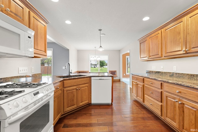 3564 Westport Dr, New Haven, IN 46774 - kitchen featuring white appliances, a sink, a peninsula, dark wood finished floors, and recessed lighting