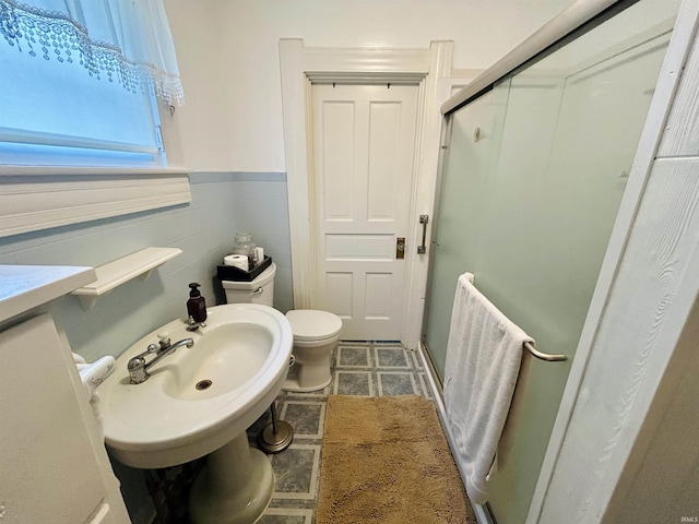 27 N Edwards St, Worthington, IN 47471 - bathroom featuring toilet, a stall shower, and wainscoting