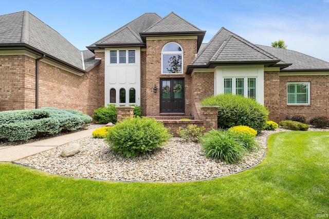 11070 Birch Lake Dr, Granger, IN 46530 - view of front of house featuring french doors, brick siding, and a front lawn