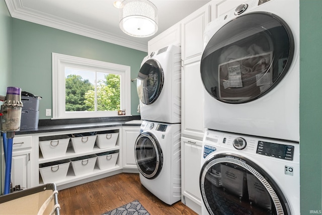 11070 Birch Lake Dr, Granger, IN 46530 - washroom featuring stacked washer and clothes dryer, cabinet space, ornamental molding, and dark wood-style flooring