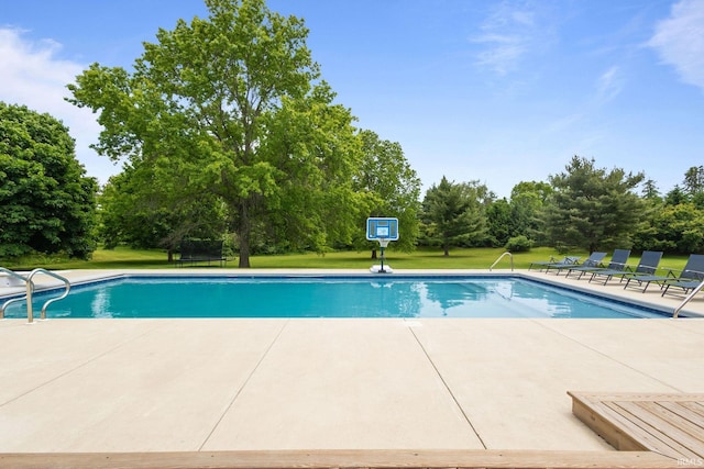 11070 Birch Lake Dr, Granger, IN 46530 - swimming pool with a yard, view of scattered trees, and a patio