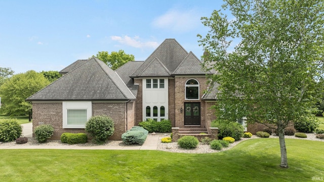 11070 Birch Lake Dr, Granger, IN 46530 - french provincial home with brick siding, a front lawn, and a shingled roof