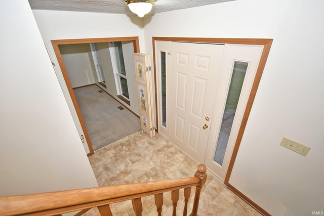 904 Brookridge Ct, Lafayette, IN 47909 - entrance foyer featuring a textured ceiling and baseboards