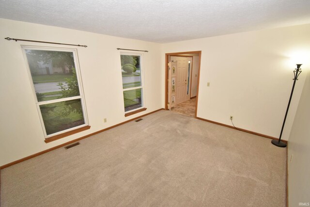 904 Brookridge Ct, Lafayette, IN 47909 - carpeted empty room with baseboards and a textured ceiling