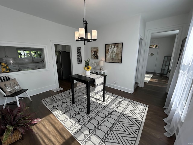 1000 Hartford St, Lafayette, IN 47900 - home office featuring a sink, a chandelier, baseboards, and dark wood finished floors