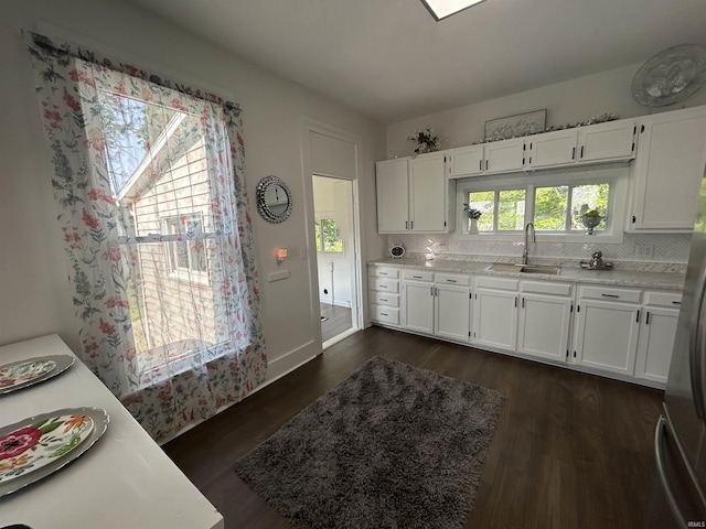 1000 Hartford St, Lafayette, IN 47900 - kitchen featuring a sink, light countertops, and white cabinets