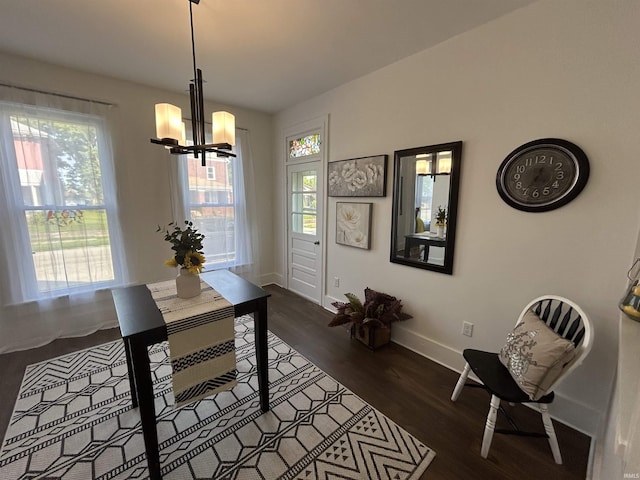 1000 Hartford St, Lafayette, IN 47900 - dining room featuring a chandelier, baseboards, and dark wood-style flooring