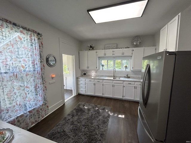 1000 Hartford St, Lafayette, IN 47900 - kitchen featuring freestanding refrigerator, a sink, white cabinets, and light countertops