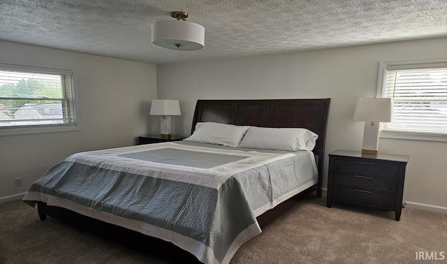 1101 E Boone St, Frankfort, IN 46041 - carpeted bedroom featuring baseboards and a textured ceiling