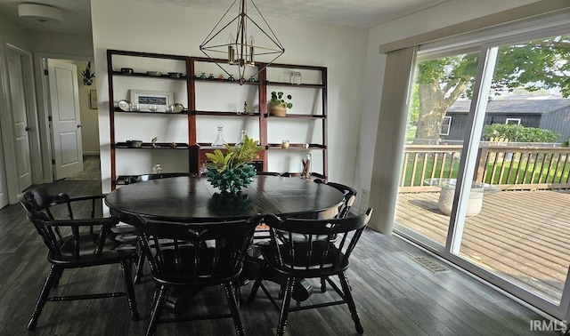 1101 E Boone St, Frankfort, IN 46041 - dining space with wood finished floors and a chandelier