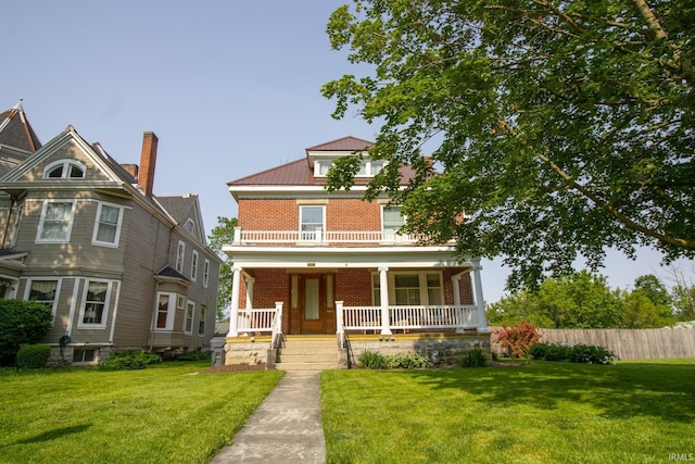 507 N Howard St, Union City, IN 47390 - american foursquare style home with brick siding, covered porch, and metal roof