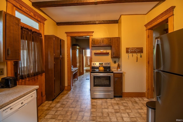 507 N Howard St, Union City, IN 47390 - kitchen with appliances with stainless steel finishes, light countertops, stone finish floors, and open shelves