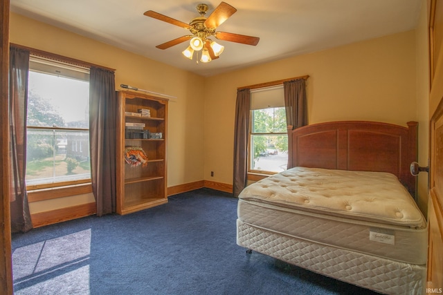 507 N Howard St, Union City, IN 47390 - bedroom featuring dark carpet, baseboards, and ceiling fan