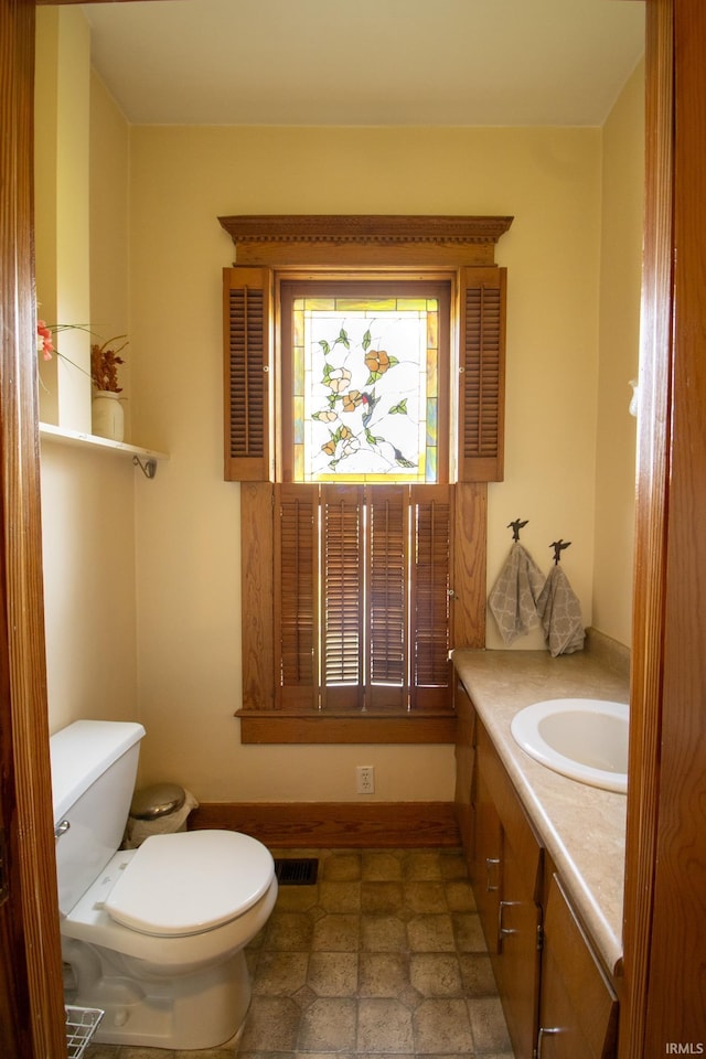 507 N Howard St, Union City, IN 47390 - bathroom featuring toilet, vanity, and baseboards