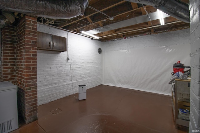 507 N Howard St, Union City, IN 47390 - unfinished basement featuring brick wall and fridge