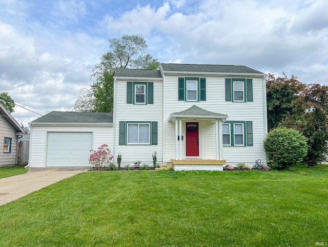158 Simpson Ave, Elkhart, IN 46516 - view of front of house with driveway, an attached garage, and a front lawn