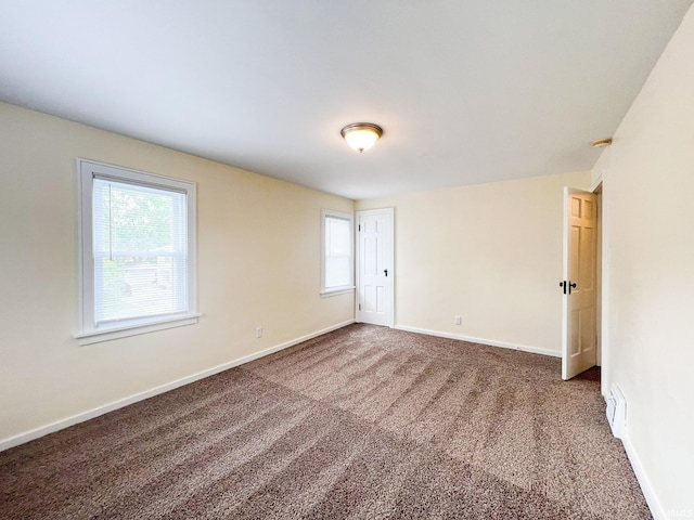 158 Simpson Ave, Elkhart, IN 46516 - carpeted empty room featuring baseboards