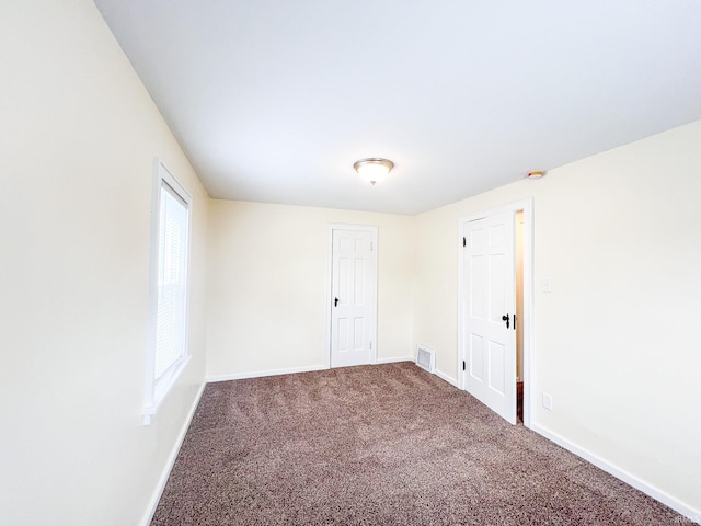 158 Simpson Ave, Elkhart, IN 46516 - spare room featuring carpet and baseboards