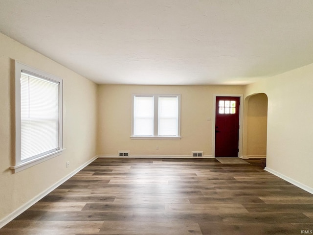 158 Simpson Ave, Elkhart, IN 46516 - entrance foyer featuring arched walkways, dark wood-style flooring, and baseboards