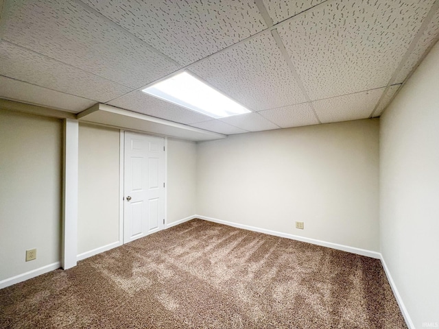 158 Simpson Ave, Elkhart, IN 46516 - finished basement with carpet flooring, a paneled ceiling, and baseboards