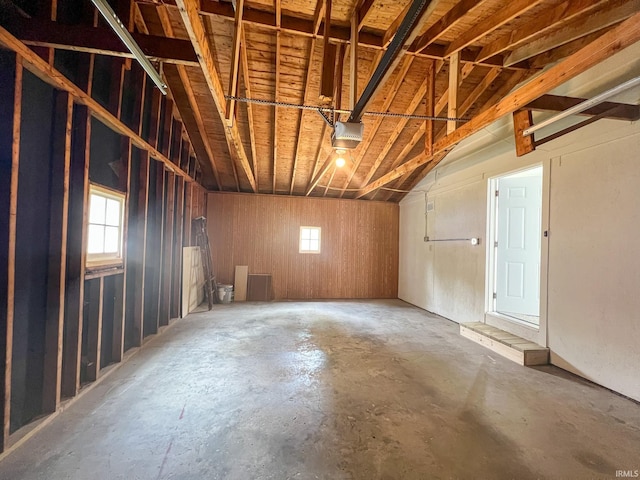 158 Simpson Ave, Elkhart, IN 46516 - misc room with a garage, concrete flooring, healthy amount of natural light, and lofted ceiling