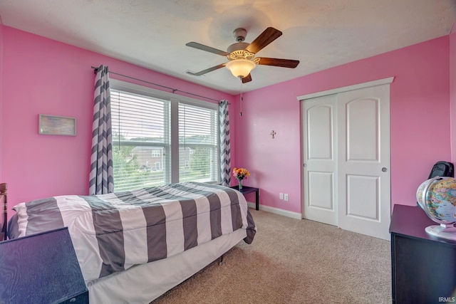 4774 W Hidden Meadow Dr, Bloomington, IN 47404 - bedroom featuring carpet floors, a closet, ceiling fan, and baseboards