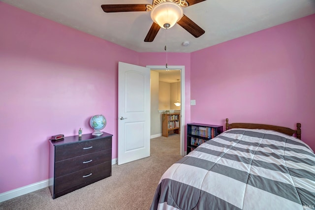 4774 W Hidden Meadow Dr, Bloomington, IN 47404 - carpeted bedroom featuring baseboards and a ceiling fan