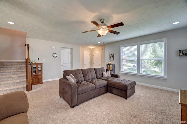 4774 W Hidden Meadow Dr, Bloomington, IN 47404 - living room with light colored carpet, ceiling fan, stairway, baseboards, and recessed lighting