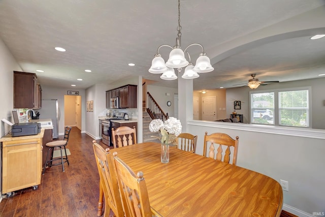 4774 W Hidden Meadow Dr, Bloomington, IN 47404 - dining space featuring dark wood finished floors, baseboards, recessed lighting, ceiling fan, and a chandelier