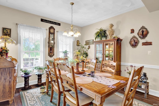 91 Smiths Rd, Mitchell, IN 47446 - dining area featuring a chandelier, wood finished floors, and baseboards
