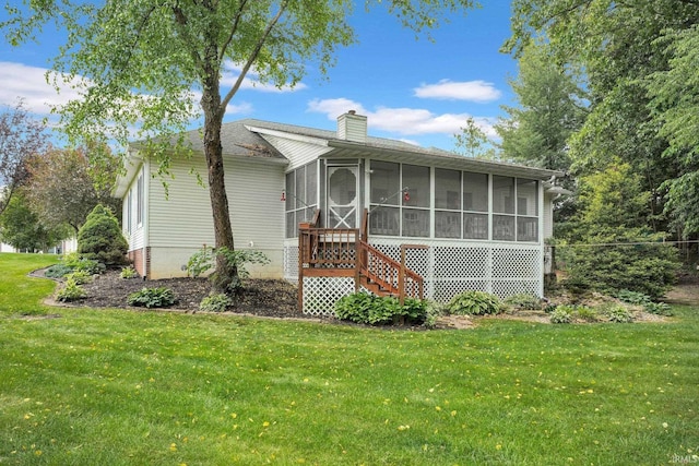 91 Smiths Rd, Mitchell, IN 47446 - view of property exterior with a sunroom, a chimney, and a yard