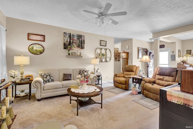 91 Smiths Rd, Mitchell, IN 47446 - living area featuring light colored carpet, a ceiling fan, baseboards, and a textured ceiling