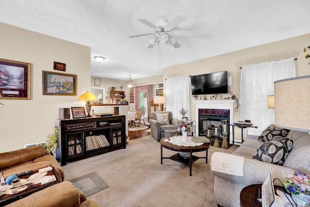 91 Smiths Rd, Mitchell, IN 47446 - carpeted living room with a ceiling fan and a glass covered fireplace