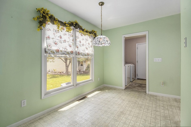 18086 Courtland Dr, South Bend, IN 46637 - unfurnished dining area with washer and clothes dryer and baseboards