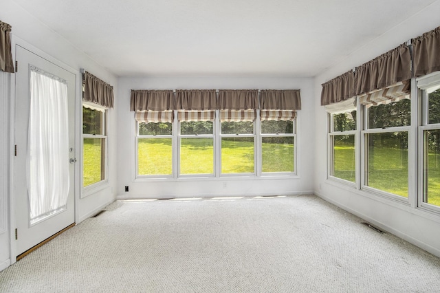 18086 Courtland Dr, South Bend, IN 46637 - unfurnished sunroom with plenty of natural light, carpet flooring, and baseboards