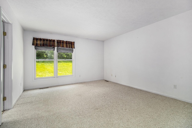 18086 Courtland Dr, South Bend, IN 46637 - carpeted empty room featuring baseboards and a textured ceiling