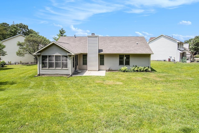 18086 Courtland Dr, South Bend, IN 46637 - rear view of property with a patio, a chimney, a yard, and a shingled roof