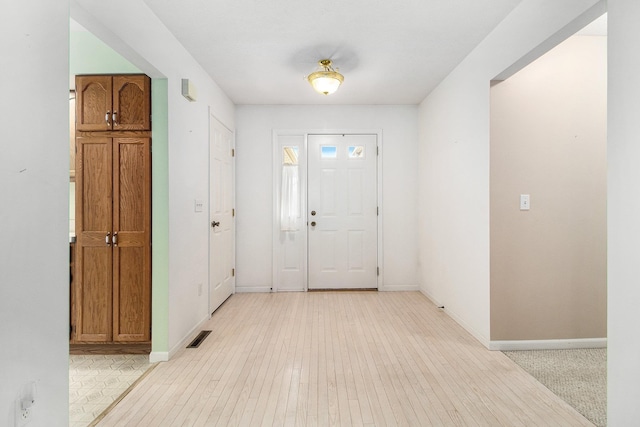 18086 Courtland Dr, South Bend, IN 46637 - foyer entrance featuring baseboards and light wood finished floors