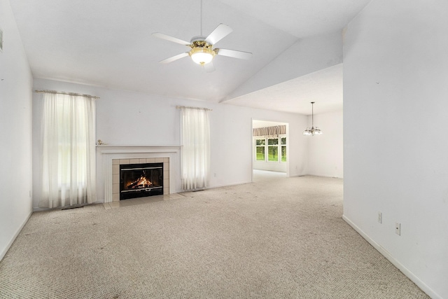 18086 Courtland Dr, South Bend, IN 46637 - unfurnished living room with a tiled fireplace, carpet flooring, vaulted ceiling, ceiling fan, and baseboards