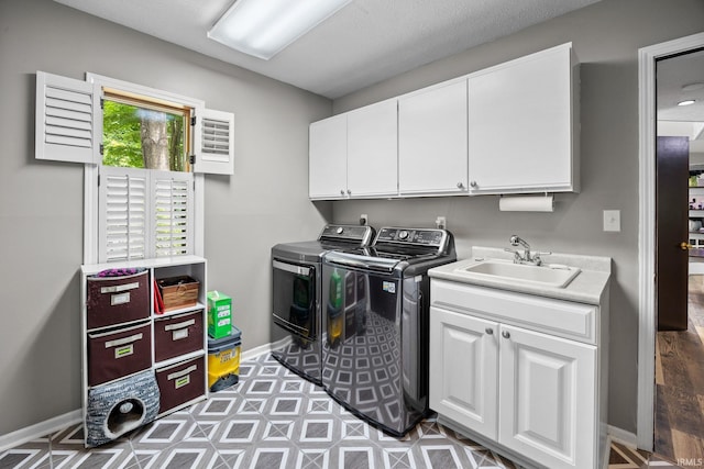 1320 Castle Dr, Lafayette, IN 47905 - washroom featuring washing machine and clothes dryer, cabinet space, and baseboards