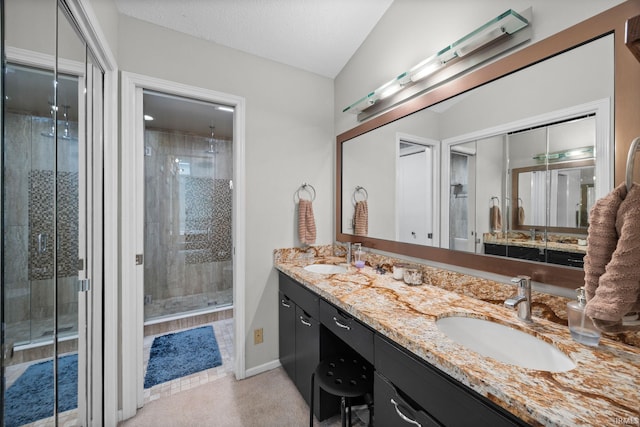 1320 Castle Dr, Lafayette, IN 47905 - bathroom featuring double vanity, a shower stall, and baseboards
