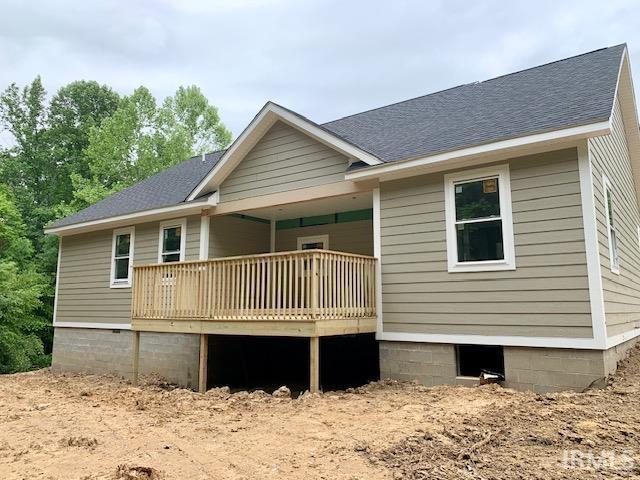11472 E Wagner Rd, Solsberry, IN 47459 - rear view of house featuring a wooden deck and roof with shingles