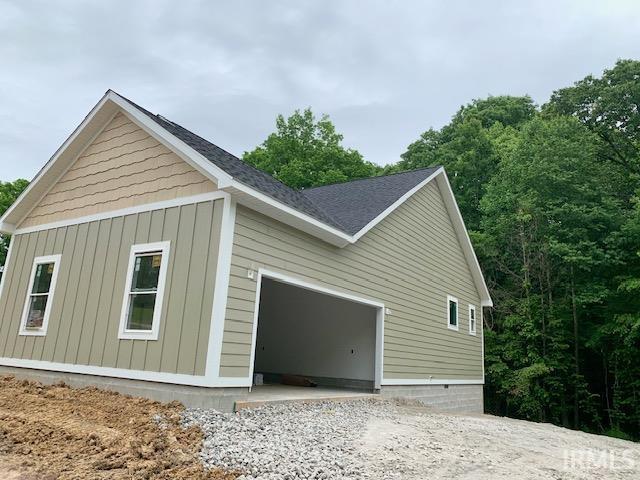 11472 E Wagner Rd, Solsberry, IN 47459 - view of side of home with an attached garage